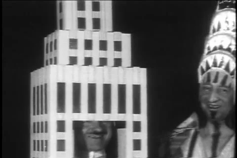 Archival Masque ball  - Men dressed as buildings 1931 Stock Footage 194982003