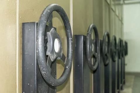 Archive boxes for documents lined up in a storage area with large handles o.. Stock Photos
