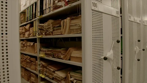 In an archive the camera moves out a shelf inside relocation shelves. Stock-Footage 95429160