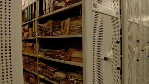 In an archive the camera moves to a shelf inside relocation shelves. Stock-Footage 95443611