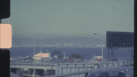 Archive footage 1970s, traffic queue on Bay Bridge approaching San Francisco Stock Footage 327199194