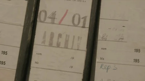 In an archive, slow camera movement via old german folders and files. Stock-Footage 95447114