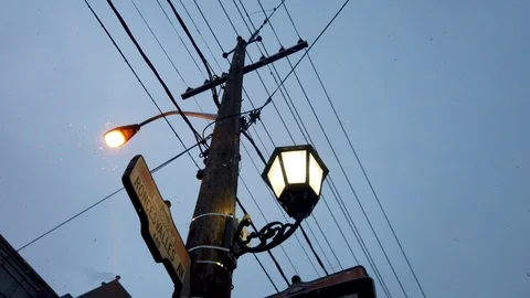 Arcing show of Street Light in snow fall 4k slow motion Stock Footage 102767636