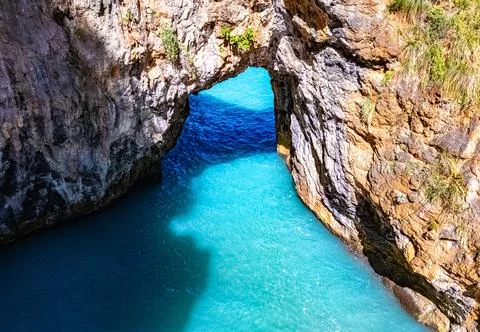 Arcomagno Beach or Beach of the Great Arch near San Nicola Arcella, in the pr Stock Photos