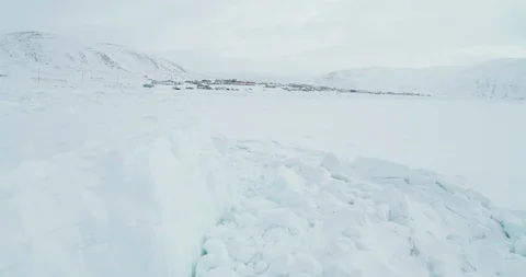 Arctic Aerial Tracking back across frozen arctic ice shelf Video stock 113870624