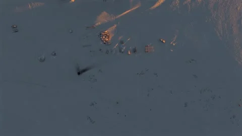 Arctic Base With Equipment Sled Tracks and Wooden Structures at Golden Hour Stock Footage 345329672