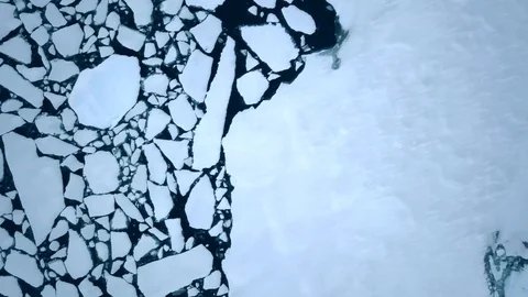 Arctic climate change - Greenland sea-ice melt & cracking, aerial Stock Footage