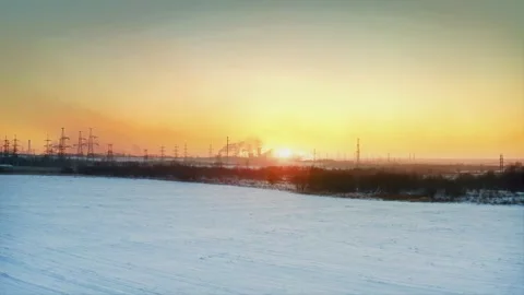Arctic Energy. Sunset Over Wintry Industrial Terrain, Power, Pollution. Aerial Stock Footage 257784981