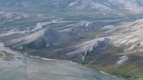 Arctic hills and river delta meeting the coast of Lavrentiya Bay, Chukotka Stock Footage 327124269