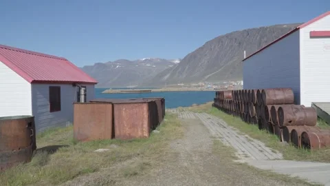 Arctic History Preservation, Pathway Flanked by Historic Rusted Whaling Drums Stock Footage 341334660