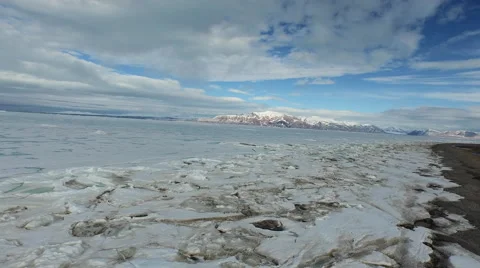 Arctic Landscape Over Ice Covered Water, Sky and Land Mass beyond Stock Footage 56654876