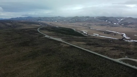 Arctic Mountains with growing storm system, Aerial View, Wilderness Road Stock Footage 289486191