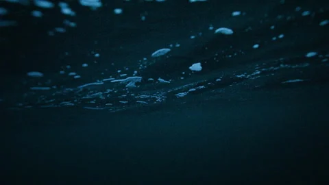 Arctic Ocean Underwater Surface with Ripples and Rising Bubbles Stock Footage 333861755
