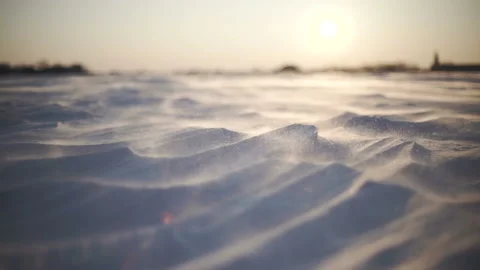 Arctic Storm. Close-up shot of snow storm at sunset. Wind picks snowflakes  Stock Footage 86574124
