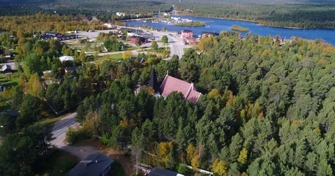 Arctic town, Cinema 4k aerial vertigo effect view of the church and Inari tow Stock Footage 82185853