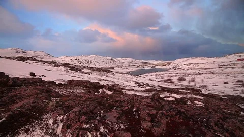 Arctic tundra at sunset during a strong wind 스톡 동영상 84764956