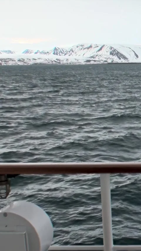 Arctic Voyage Navigating Restless Waves and Snow-Capped Peaks Stock Footage 340485574