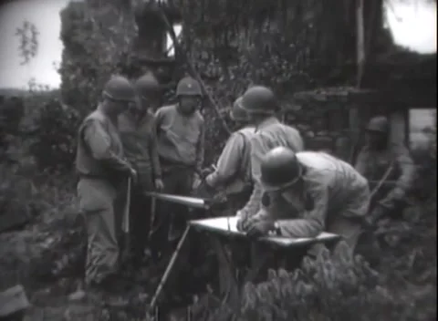 ARDENNES - 1944: Dugout map work - Soldiers work over a map beside a stone edge Vídeo Stock 344488963