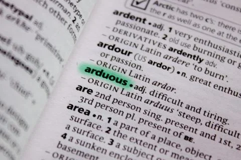 Arduous word or phrase in a dictionary. Stock Photos