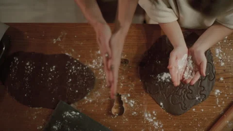 Are preparing cookies for the New Year and Christmas in the kitchen. 스톡 동영상 145231024