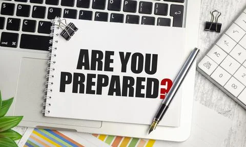 Are You Prepared text on notepad and laptop on wooden background Stock-Fotos