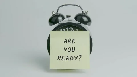Are you Ready Text or Word on Yellow Note Paper Sticking onto Black Clock Stock Footage 299972432