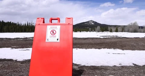 Area closed for bear &amp; wildlife activity caution/warning/danger sign, snow melt Stock-Footage 334630907