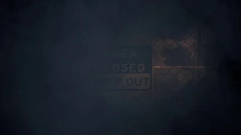 AREA CLOSED KEEP OUT Signs on a Metal Fence in a Storm Stock Footage 78883536