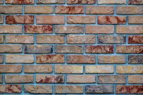 Area, facing brick colored as if tanned. Stock Photos