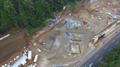 Area under construction near the forest and the highway Stock Footage 93101927