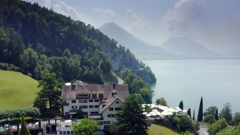 Areal Drone Flight over Hotel FloraAlpina Vitznau to Lake Lucerne and Swiss Alps Stock Footage 157762466