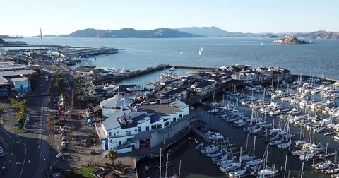Areal Drone San Francisco Pier 39 with Golden Gate Bridge and Alcatraz Stock Footage