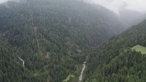 Areal footage of mountain river in Apls in cloudy day Stockbeeldmateriaal 252151489