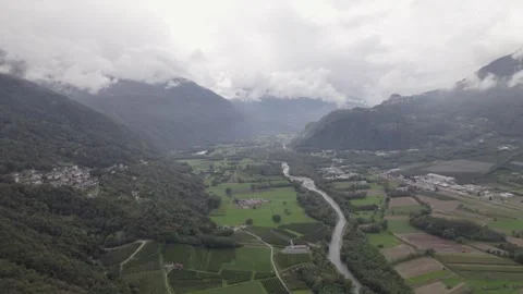 Areal footage of traffic on road surrounded by alps 스톡 동영상 252151255