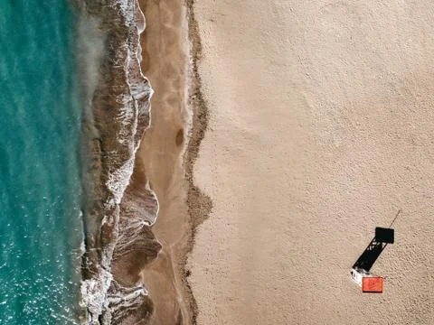 Areal top down view on sand beach and lifeguard tower. Port Adriano Stock Photos
