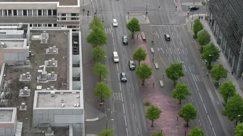 Areal view all over the roofs to the flowing traffic in the streets of Berlin Stock Footage 196943734