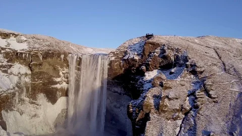 Areal view of a beautiful waterfall known as Skogafoss during winter in Iceland. Stock Footage 87494341