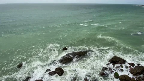 Areal views blue ocean waves on rock beach Stock Footage 167695402