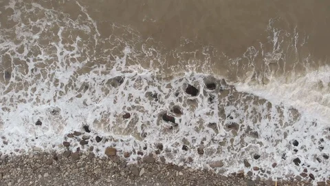 Areial view of a foamy surf on the black sea rocky coast at winter season. Stock Footage 101306321