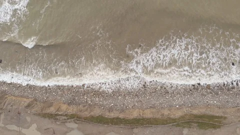 Areial view of a foamy surf on the black sea rocky coast at winter time. Stock Footage 101306341