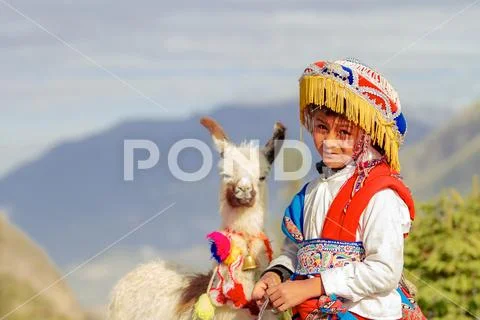 Arequipa, Peru - February 5, 2018: Peruvian boy poses for a portrait with a t Stock Photos