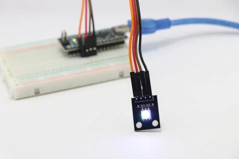ARGB LED module connected to breadboard using jumper wires Stock Photos