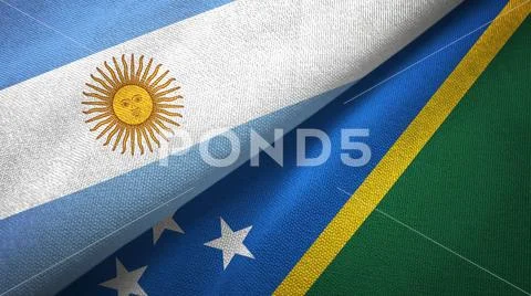 Argentina and Solomon Islands two flags textile cloth, fabric texture Stock Photos