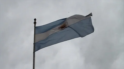 Argentina Flag Flies Against Cloudy Sky Stock Footage 105992196