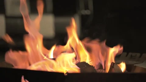 Argentina. Glowing outdoor fire pit with vibrant orange flames. Static closeup Stock Footage 341552428