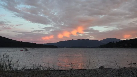 Argentina reflections of pink clouds over lake Stock Footage 107956785