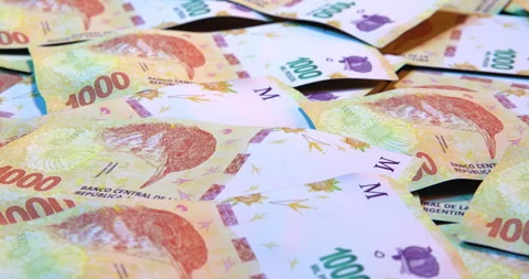 Argentinean Pesos in a loop Stock Footage 251344006