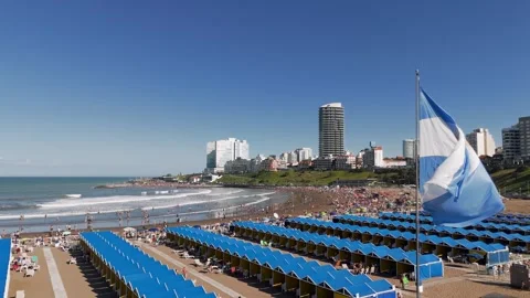 Argentinian flag passes in the foreground while the camera travels Stock Footage 325756614