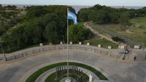 Argentinian flag waving in slow motion with green park at background Stock Footage 153637688