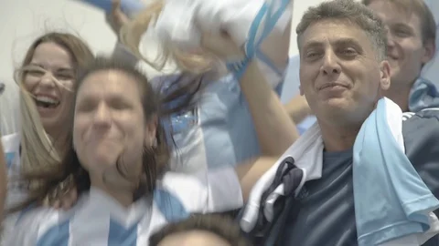 Argentinian football fans cheering at match Stock Footage